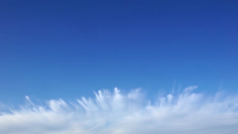 beautiful blue sky with wispy clouds