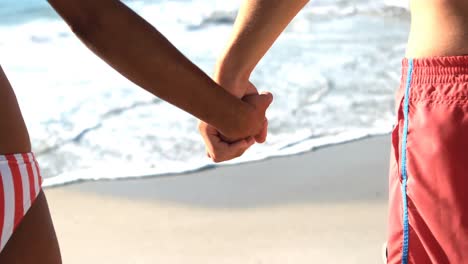 Couple-standing-on-beach