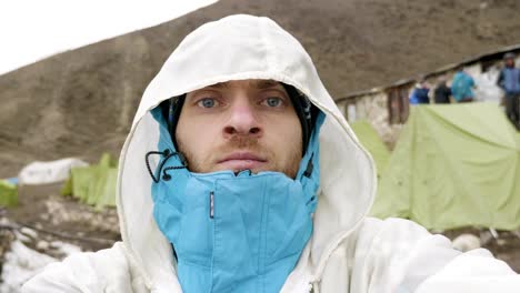 man in the mountains of nepal. dharmasala village, larke pass, 4700 m altitude.