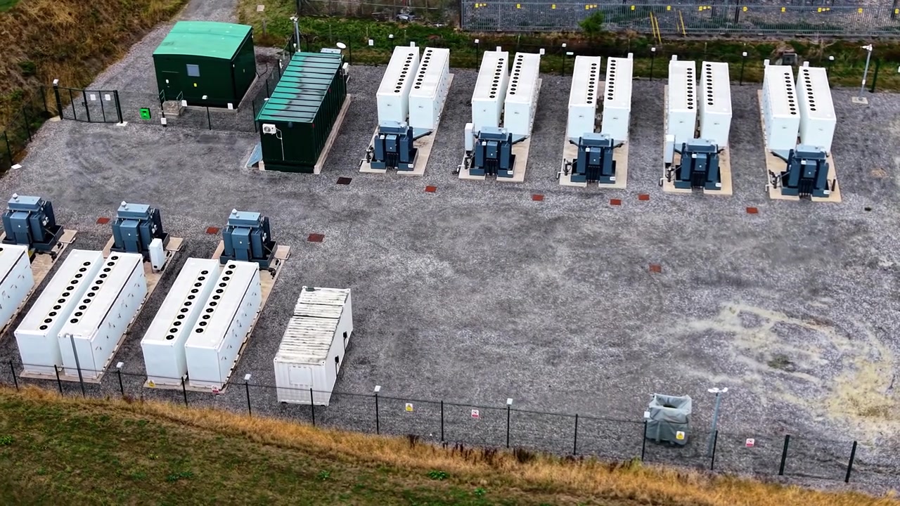 Slow Orbit Around BESS Battery Energy Storage System near Electrical Substation in UK. Modern Lithium-ion Batteries Storing Power.