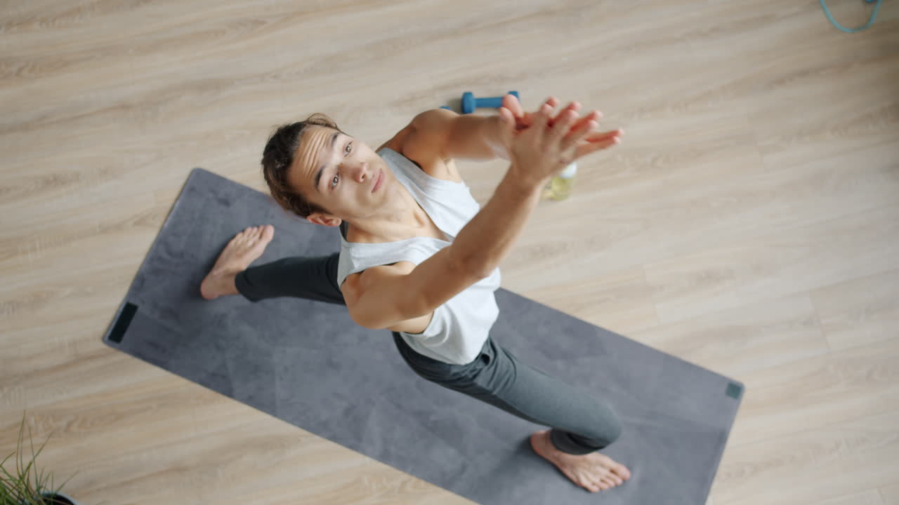 Man Practicing Warrior Yoga Pose