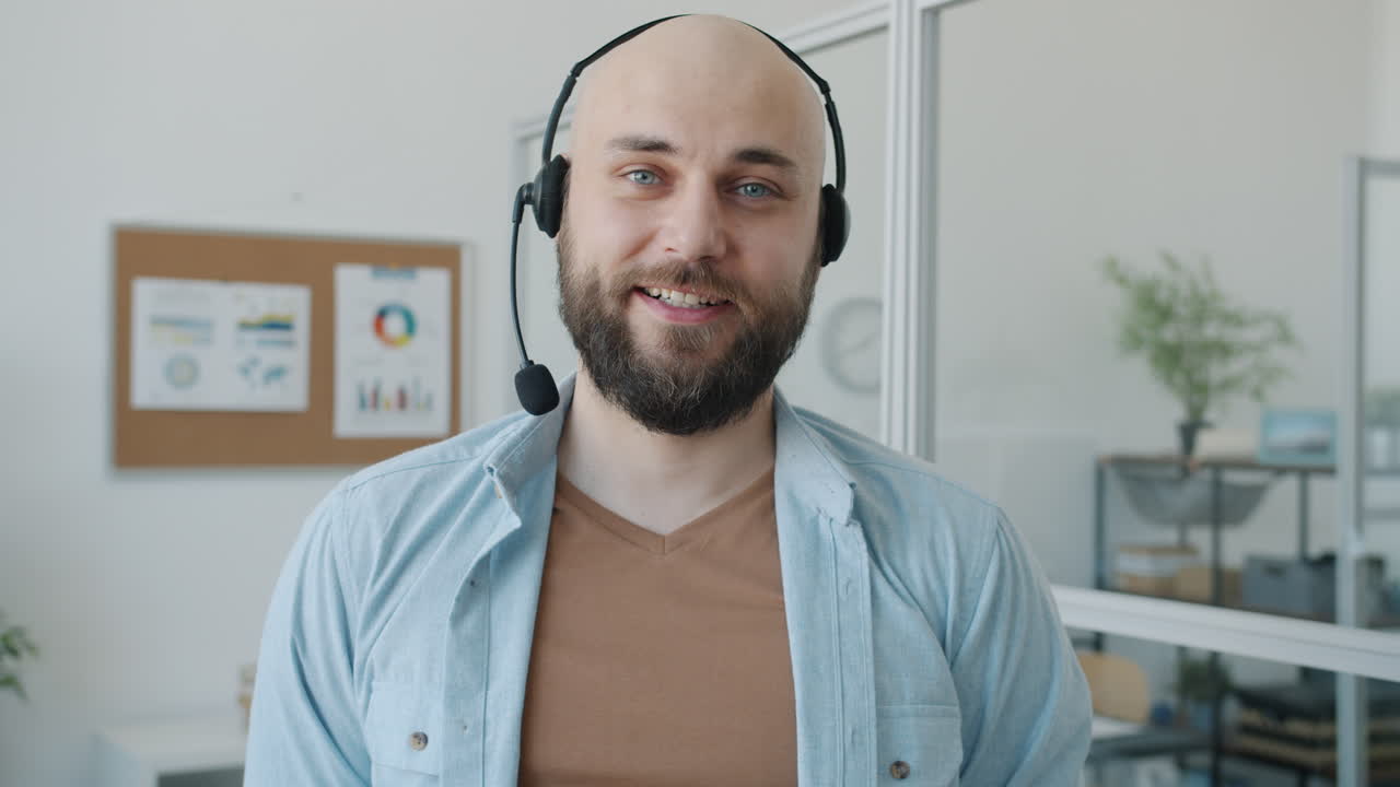 Smiling Businessman Wearing Headset in Office