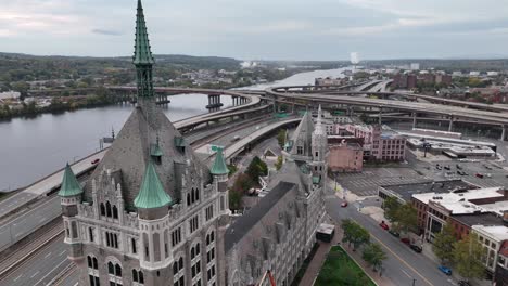 aerial over gothic looking suny albany along busy roadway in albany ny, new york