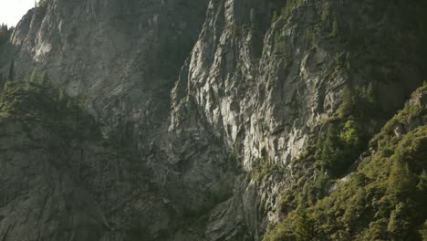 Slow-Pan-Down-View-Of-Cliffs-Down-To-Merced-River-In-Yosemite