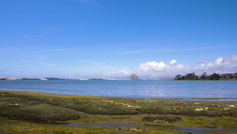 Moro-Bay-Rock-looking-over-marsh-lowlands-with-sand-dunes