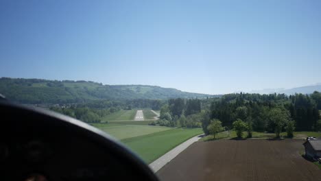 aerial view of abandoned airport, small private plane landing on runway