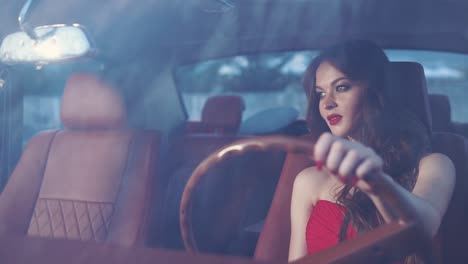 woman driving a classic car