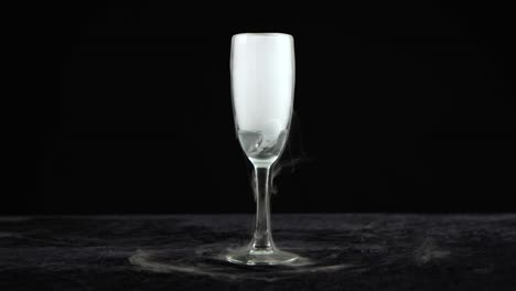 drink in glass of champagne with the effect of dry ice