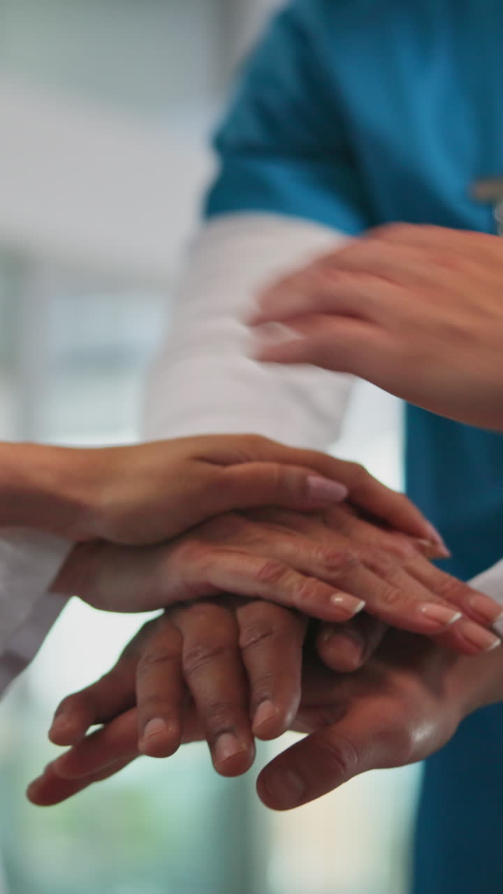 Medical Team Stacking Hands in a Gesture of Unity