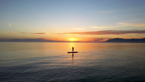 beautiful-view-of-a-silhouette-paddle-surfing-at-sunset-in-on-the-Mediterranean-sea-just-off-the-coast-of-Marbella-dream-holiday