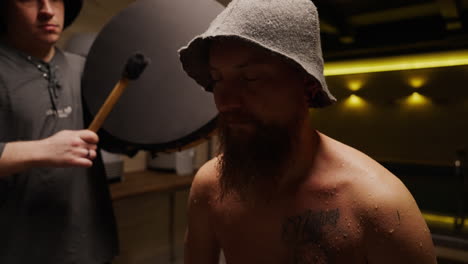man in a medieval hat in studio photography session