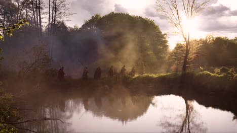 ancient warriors marching through a misty forest at sunset