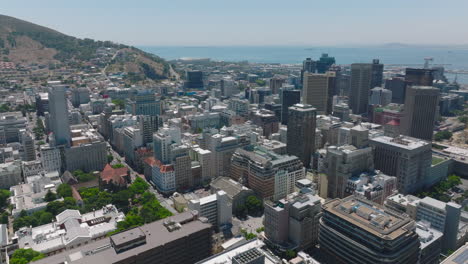 Forwards-fly-above-urban-borough.-Multistorey-luxurious-commercial-downtown-buildings.-Cape-Town,-South-Africa