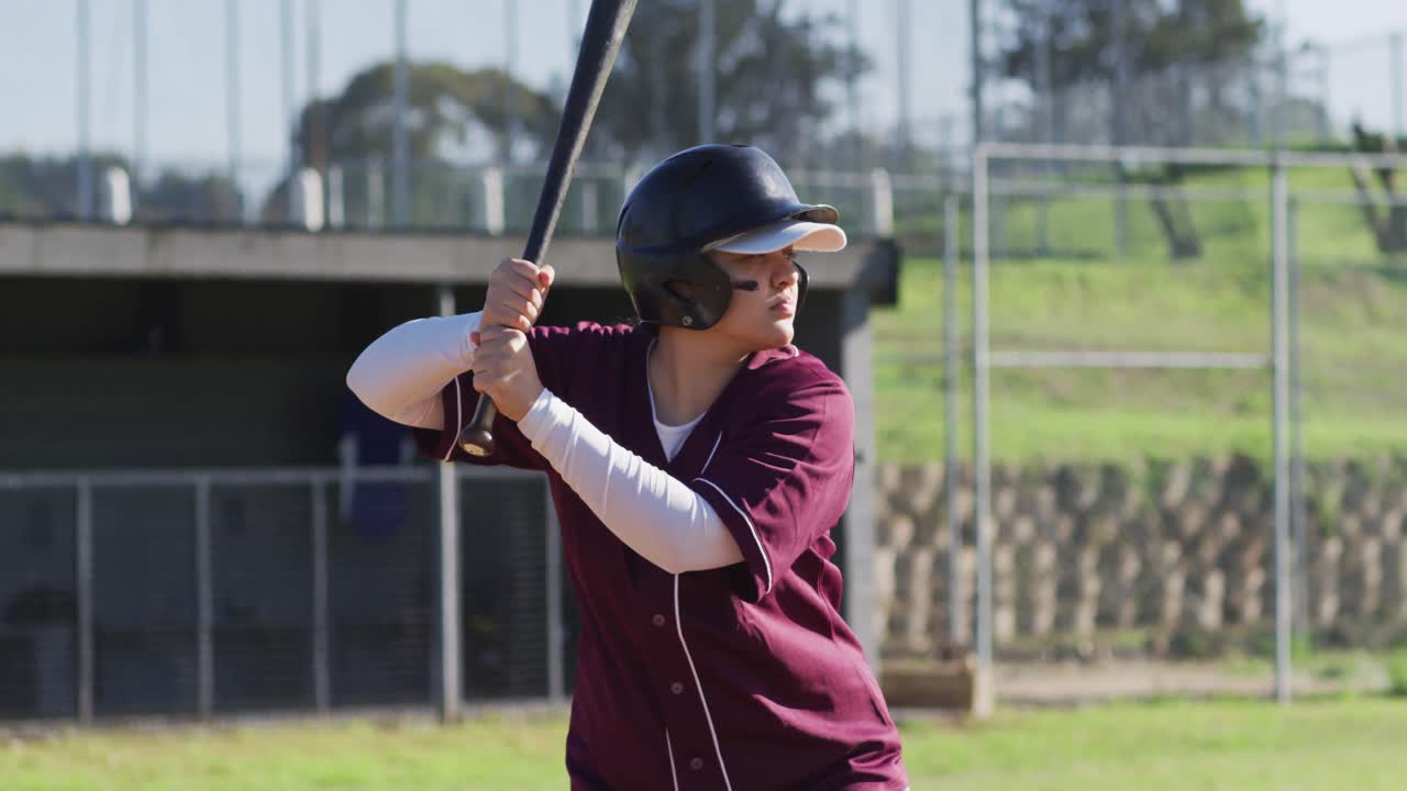 Mixed Race Female Baseball Player, Hitter, Swinging Bat For Pitched Ball  Free Stock Video Footage Download Clips