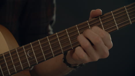 slow motion shot of man playing acoustic guitar