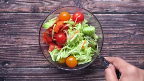 preparing a fresh vegetable salad