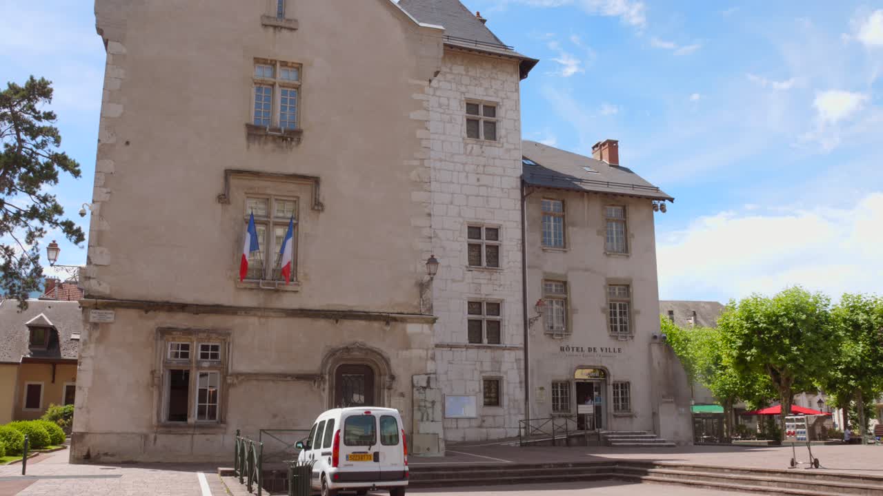 A stunning architecture of the Town Hall at the Château of the Marquis, basking in sunlight against a vibrant sky, evoking a sense of timeless elegance. Aix-les-Bains