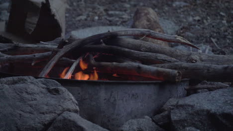 close up of a campfire with camping stove for outdoor cooking after a day of hike trekking in the wilderness