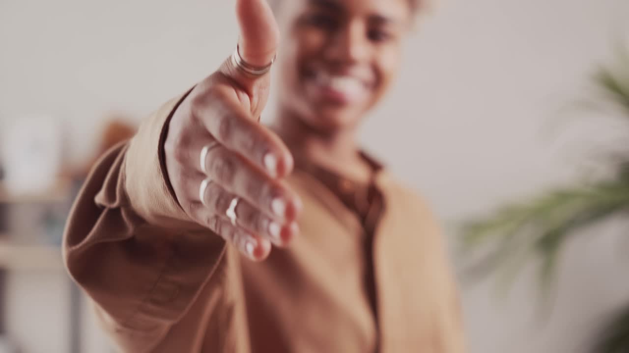Close up african woman manager stretching out hand making hello gesture