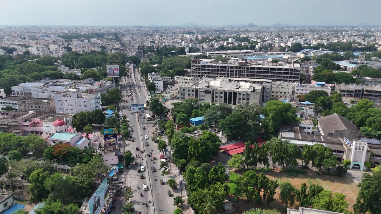 Beautiful overhead view of Vijayawada city where man-made structures meet the untouched beauty of the distant hill.