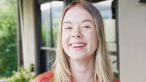 portrait of a happy caucasian teenager girl at home, slow motion