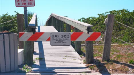 barricade restricting people from entering florida beaches due to covid-19