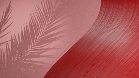 palm leaves shadow on red background wall with copy space