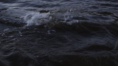 medium shot of waves flowing over concrete slab