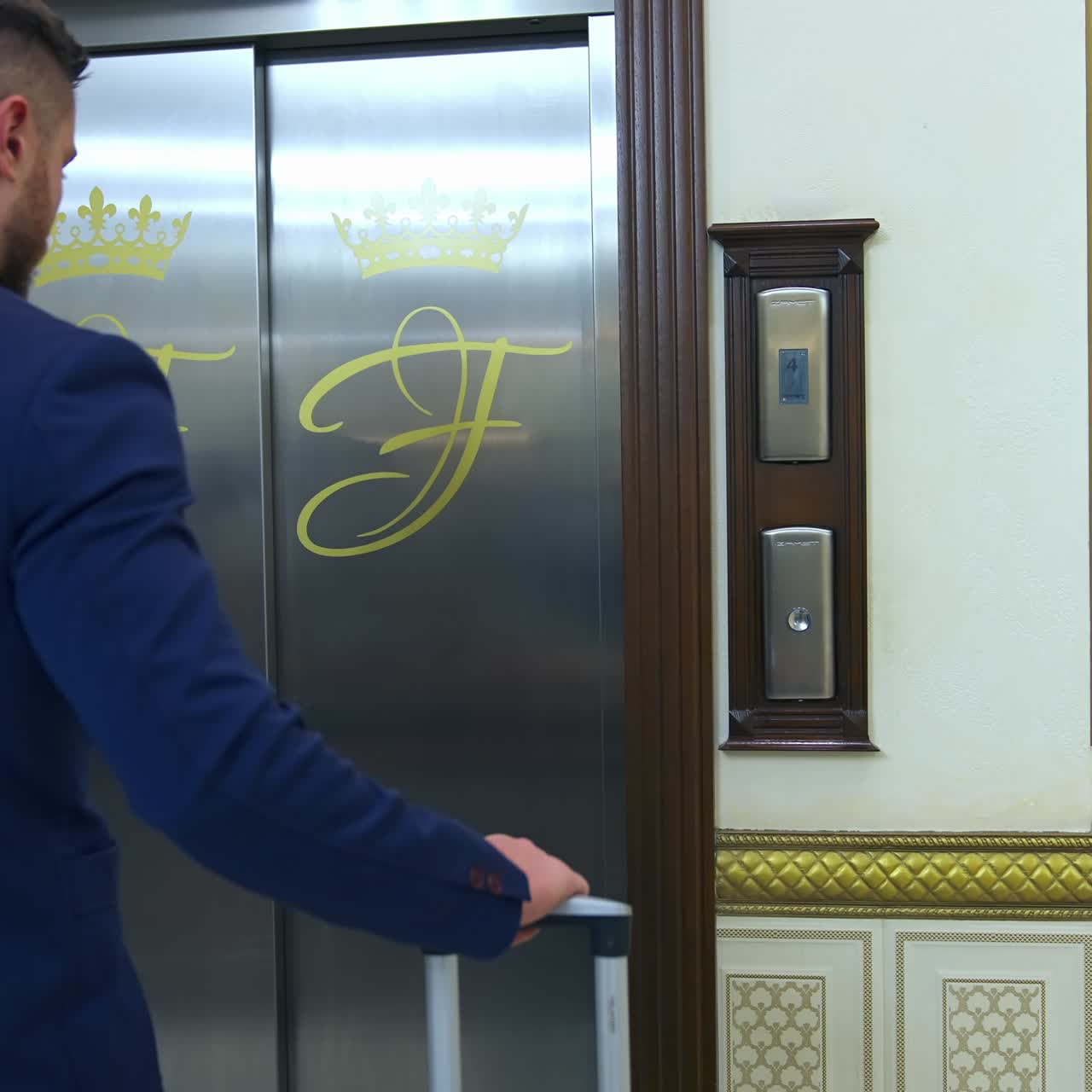 Man pushing button of elevator