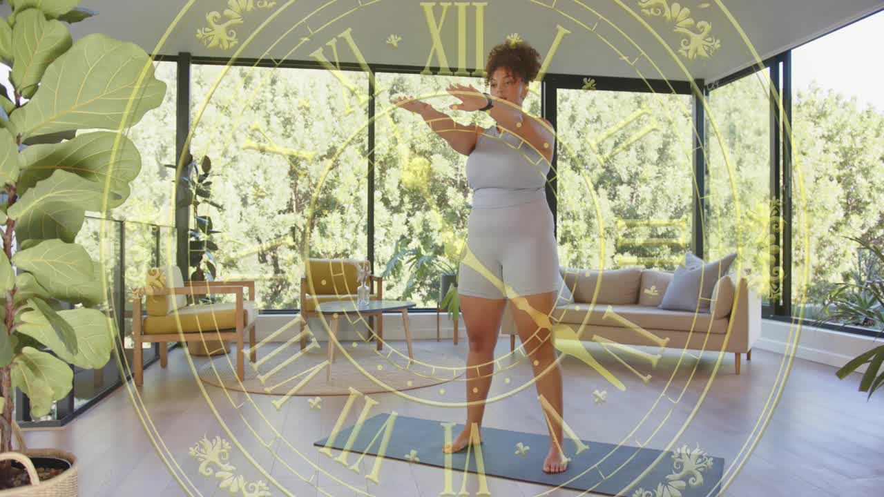 Woman following cue, doing fitness squats on yoga mat in glass room, clock overlay marking reps