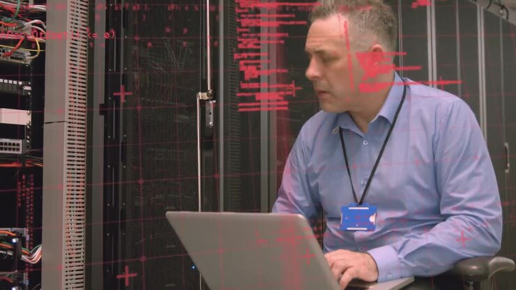 Animation of data processing over caucasian man using laptop in server room