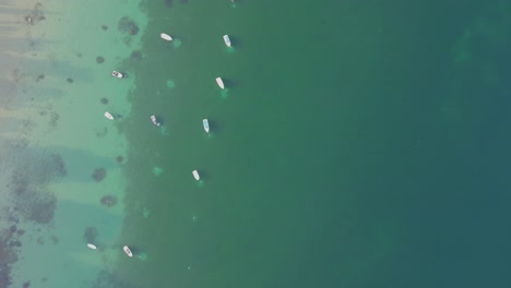 Yacht-And-Boats-Floating-In-The-Calm-Blue-Waters-Of-Lake-Garda-In-Italy