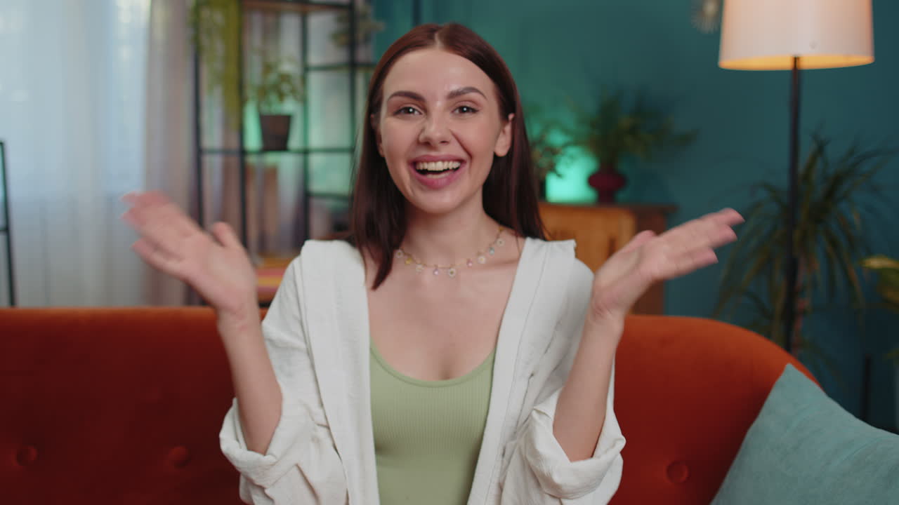 Excited young woman surprised, shocked by sudden victory, good win news, celebrating, wow reaction
