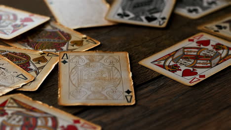 vintage playing cards on wooden table