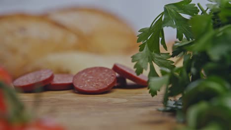 sliced turkish sausage (sucuk) rolls past the camera.