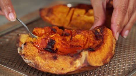 Close-up-of-Spoon-dipping-into-pumpkin-gourd-preparing-for-ingredients-seasoning-pumpkin-muffins