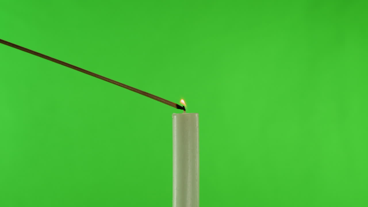 Single Lit Candle on Green Screen