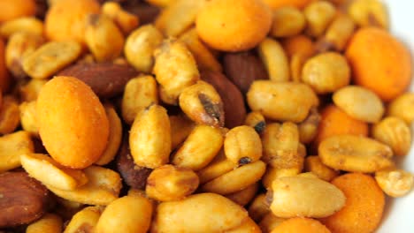 a bowl of mixed nuts and snacks