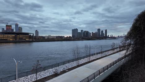 new york city skyline view roosevelt island with skyscrapers over east river at dusk