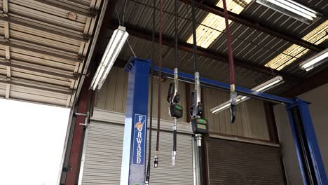 hanging oil and air cables mechanic shop pan down