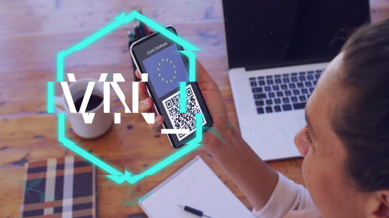 Person scanning QR code on smartphone with NFT text animation over desk