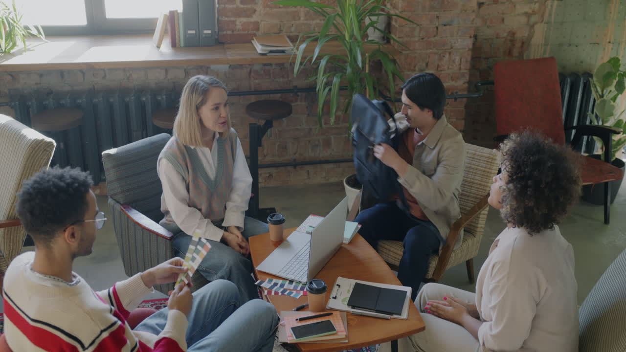 Diverse Team Meeting in Modern Coffee Shop