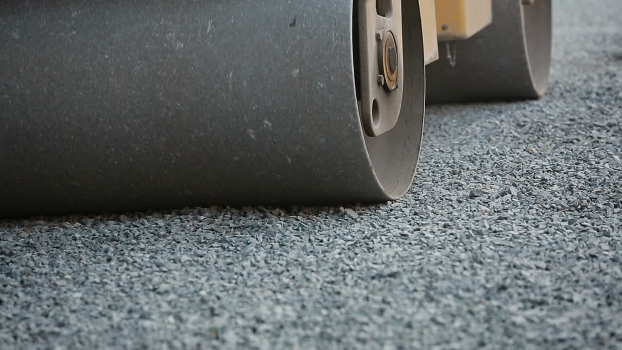 Road Roller On The Road Construction. Road roller on the road construction laying gravel