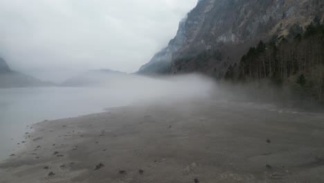 Klöntalersee-Glarus-Switzerland-mystical-misty-beach-flight-beside-lake