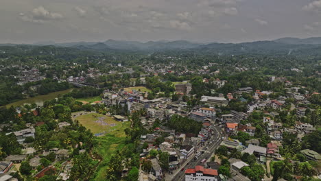 Kandy-Sri-Lanka-Aerial-v3-cinematic-drone-fly-along-A9-Katugastota-Rd-across-Mahaweli-river-capturing-townscape-of-Wattarantenna-and-Weerakoon-Gardens-suburbs---Shot-with-Mavic-3-Cine---April-2023