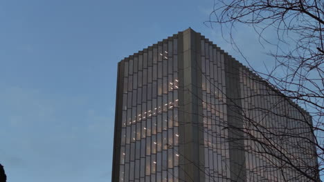 day to dusk view - modern building with glass exterior