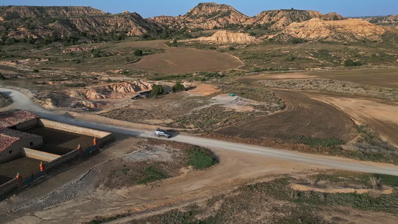 Exploring the barren environment, driver and passengers travel Spain