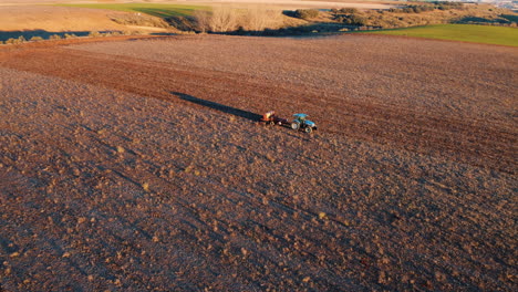 aerial view of tractor ploughing a field