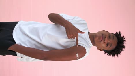 Vertical-video-of-African-teenager-showing-COVID-19-vaccine-bandage-merrily