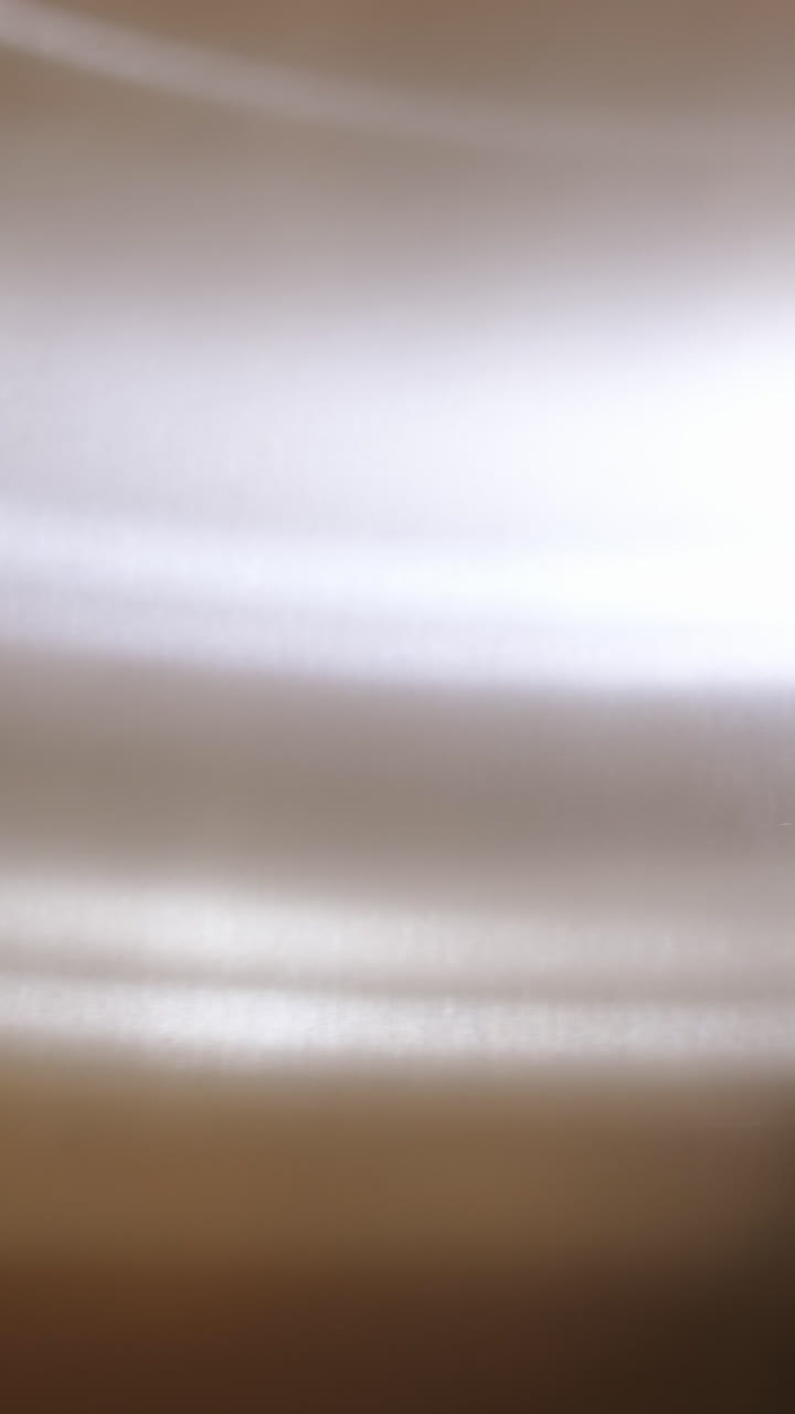 Ready to new business trip. Rear view of confident young businesswoman in formalwear pushing button while standing in elevator with suitcase. Vertical video